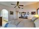 View of Main bedroom with King bed, dresser and ensuite bathroom beyond the arched doorway at 4004 Nancy Margarite Ln, Las Vegas, NV 89130