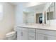 Bright bathroom featuring a double sink vanity, large mirror, and a separate shower/tub combo at 4517 Swimming Minnow Ave, Las Vegas, NV 89141