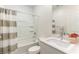 Clean bathroom featuring a shower-tub combo and a stylish vanity at 4517 Swimming Minnow Ave, Las Vegas, NV 89141
