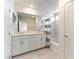 Bathroom featuring double sinks, modern fixtures and shower/tub combo at 4517 Swimming Minnow Ave, Las Vegas, NV 89141