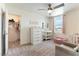 Cozy bedroom with a closet, dresser, and changing table area at 4517 Swimming Minnow Ave, Las Vegas, NV 89141