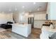 Modern kitchen with stainless steel appliances, a center island, and open layout at 4517 Swimming Minnow Ave, Las Vegas, NV 89141