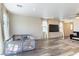Bright living room with wood floors, large windows, and a play area for  at 4517 Swimming Minnow Ave, Las Vegas, NV 89141