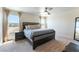 Spacious primary bedroom with large windows and a comfortable bed at 4517 Swimming Minnow Ave, Las Vegas, NV 89141