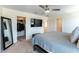 Comfortable primary bedroom featuring walk in closet and mounted TV at 4517 Swimming Minnow Ave, Las Vegas, NV 89141