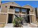 Inviting two-story condo featuring stairs to upper units, and neutral toned horizontal siding at 4720 Krissylouise Way, Las Vegas, NV 89121