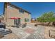 A backyard featuring a patio with an umbrella and outdoor furniture at 4902 Guysborough St, Las Vegas, NV 89148