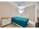 Cozy bedroom featuring carpeted floors and a simple design with natural light at 4902 Guysborough St, Las Vegas, NV 89148