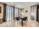 Bright dining room with a dark table, gray chairs, and natural light through sheer curtains at 4902 Guysborough St, Las Vegas, NV 89148