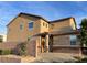 Attractive home featuring stucco siding, stone accents, and mature landscaping at 4902 Guysborough St, Las Vegas, NV 89148
