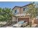 Two-story home featuring a two-car garage and brick-paved driveway at 4902 Guysborough St, Las Vegas, NV 89148