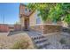 Charming two-story home with a stone-accented facade and inviting brick-paved walkway at 4902 Guysborough St, Las Vegas, NV 89148