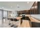 Well-equipped kitchen with granite countertops, stainless steel appliances, and an island with seating at 4902 Guysborough St, Las Vegas, NV 89148