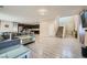 Bright, open-concept living space with hardwood floors and modern decor, seamlessly flowing into the kitchen at 4902 Guysborough St, Las Vegas, NV 89148
