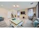 Spacious living room with hardwood floors, contemporary furnishings, and an open layout at 4902 Guysborough St, Las Vegas, NV 89148