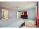 Open main bedroom with carpet flooring, dresser, and ensuite bathroom entrance at 4902 Guysborough St, Las Vegas, NV 89148