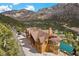 Aerial view of beautiful mountain log home, surrounded by lush trees and scenic views at 4927 Snow White Rd, Las Vegas, NV 89124