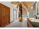 Bathroom featuring a soaking tub, stone sink, and elegant design at 4927 Snow White Rd, Las Vegas, NV 89124