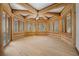 This bedroom is a log cabin design with light hardwood floors and lots of natural light at 4927 Snow White Rd, Las Vegas, NV 89124