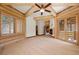 Unique architecture highlights this bedroom featuring log walls, ceiling beams, and light hardwood flooring at 4927 Snow White Rd, Las Vegas, NV 89124