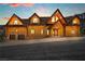 Striking log home with a multi-car garage offers curb appeal and mountain views at 4927 Snow White Rd, Las Vegas, NV 89124