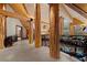 Spacious hallway with marble flooring, wooden beams, log pillars and railings with nature scenes at 4927 Snow White Rd, Las Vegas, NV 89124