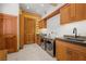 Well-equipped laundry room with custom cabinets, modern appliances, and ample counter space at 4927 Snow White Rd, Las Vegas, NV 89124