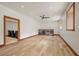 Spacious living room with wood floors, neutral walls, and an open doorway to the media room at 4927 Snow White Rd, Las Vegas, NV 89124