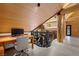 This log cabin office with marble flooring features a desk and nature themed railings overlooking a view at 4927 Snow White Rd, Las Vegas, NV 89124