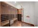 Inviting sauna with wooden benches, glass door and wood flooring at 4927 Snow White Rd, Las Vegas, NV 89124