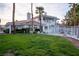 View of the expansive backyard featuring a green lawn and partial view of the home at 4944 Spanish Heights Dr, Las Vegas, NV 89148