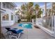 Backyard with pool, lounge chairs and patio at 4944 Spanish Heights Dr, Las Vegas, NV 89148