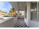 Stylish balcony with patterned tile, offering scenic neighborhood views with lush palm trees and ample natural light at 4944 Spanish Heights Dr, Las Vegas, NV 89148
