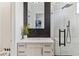 Contemporary bathroom with black and white tile, and a glass-enclosed shower at 4944 Spanish Heights Dr, Las Vegas, NV 89148