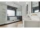 Modern bathroom features a glass-enclosed shower, white countertops, and elegant fixtures at 4944 Spanish Heights Dr, Las Vegas, NV 89148