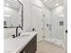 Modern bathroom featuring dark fixtures, minimalist design, and a glass-enclosed shower for a clean, contemporary feel at 4944 Spanish Heights Dr, Las Vegas, NV 89148