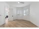 Bright bedroom with wood floors, shuttered windows and neutral color palette at 4944 Spanish Heights Dr, Las Vegas, NV 89148