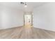 Bright bedroom with light wood flooring, minimalist design, and ample space for furniture arrangement at 4944 Spanish Heights Dr, Las Vegas, NV 89148