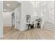 Bright foyer with light wood floors, a modern staircase, and stylish console table at 4944 Spanish Heights Dr, Las Vegas, NV 89148