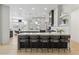 Modern kitchen with two islands, stainless steel appliances, an eating area, and gray cabinets at 4944 Spanish Heights Dr, Las Vegas, NV 89148