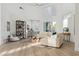 Bright, modern living room featuring high ceilings, clerestory windows, and a comfortable, oversized sectional sofa at 4944 Spanish Heights Dr, Las Vegas, NV 89148