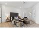 Comfortable primary suite with a sitting area, decorative rug, wood floors, and lots of natural light at 4944 Spanish Heights Dr, Las Vegas, NV 89148