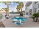 Beautiful backyard featuring a private pool, lounge chairs, and lush landscaping at 4944 Spanish Heights Dr, Las Vegas, NV 89148