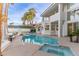 Backyard pool with patio, palm trees, spa and privacy fence, perfect for outdoor relaxation at 4944 Spanish Heights Dr, Las Vegas, NV 89148