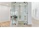 Contemporary, glass-enclosed wine cellar with shelving for storing wine bottles at 4944 Spanish Heights Dr, Las Vegas, NV 89148