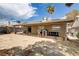 This expansive backyard boasts a covered patio, making it perfect for outdoor gatherings and relaxation at 5045 Sock Hop Way, North Las Vegas, NV 89031