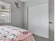 Bright bedroom featuring a ceiling fan, window, and a patterned bed at 5045 Sock Hop Way, North Las Vegas, NV 89031