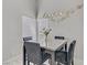 Close up of a breakfast nook table next to a bright window at 5045 Sock Hop Way, North Las Vegas, NV 89031