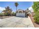 Front exterior features a two-car garage, low maintenance yard, and a desert landscape at 5045 Sock Hop Way, North Las Vegas, NV 89031