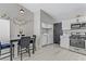 Kitchen with a breakfast table, stainless steel appliances, and a convenient laundry area at 5045 Sock Hop Way, North Las Vegas, NV 89031